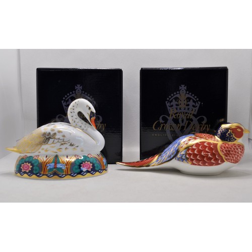 90 - Royal Crown Derby Swan paperweight gold stopper in original box, together with a pheasant paperweigh... 