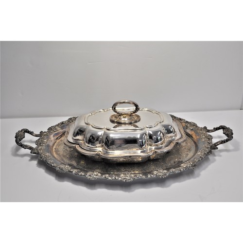 105 - A collection of silver and plateware items to include serving dishes and tray, spoons, sugar tongs, ... 