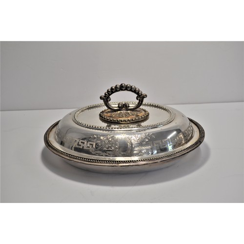 105 - A collection of silver and plateware items to include serving dishes and tray, spoons, sugar tongs, ... 