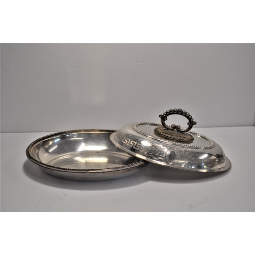 105 - A collection of silver and plateware items to include serving dishes and tray, spoons, sugar tongs, ... 