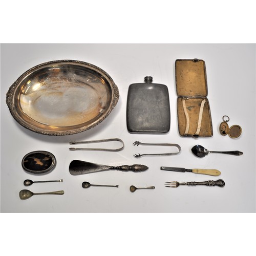 105 - A collection of silver and plateware items to include serving dishes and tray, spoons, sugar tongs, ... 