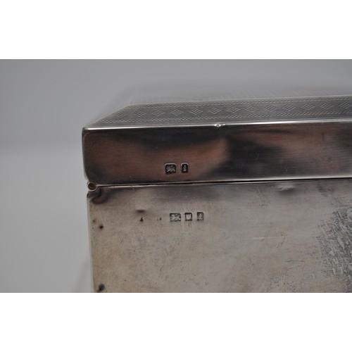 107 - Silver cigarette box with an engine turned design  top reads ' R.H.M 28 May 1926', hallmarked London... 