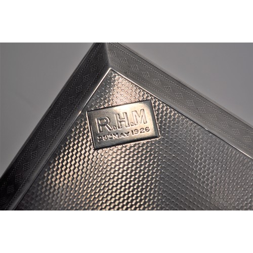 107 - Silver cigarette box with an engine turned design  top reads ' R.H.M 28 May 1926', hallmarked London... 