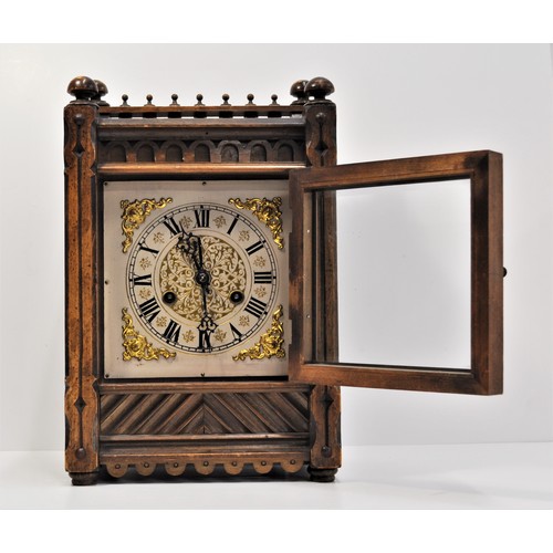 49 - Antique continental bracket clock with a gallery design to top, silver dial with roman numerals and ... 