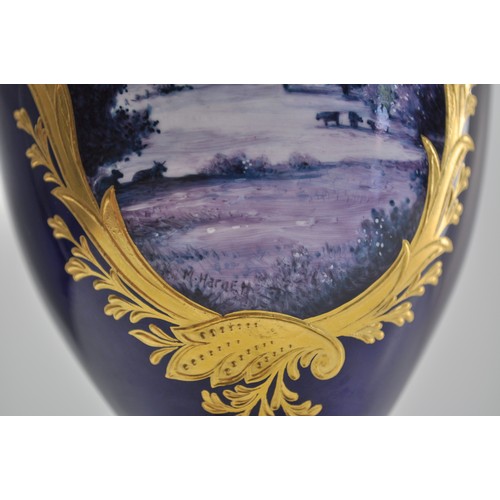 82 - Wedgwood  twin handled lidded urn with hand painted scene and gilded decoration, signed M Harnett lo... 