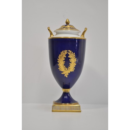 82 - Wedgwood  twin handled lidded urn with hand painted scene and gilded decoration, signed M Harnett lo... 