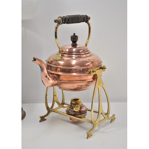 42 - Brass/Copper spirit kettle on warmer stand, together with Aladdin oil lamp with glass funnel and sha... 