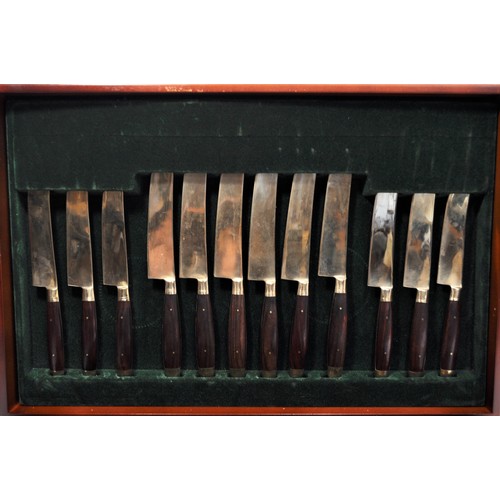 66 - 6 person cased canteen of cutlery finished in a gold tone with wooden handles