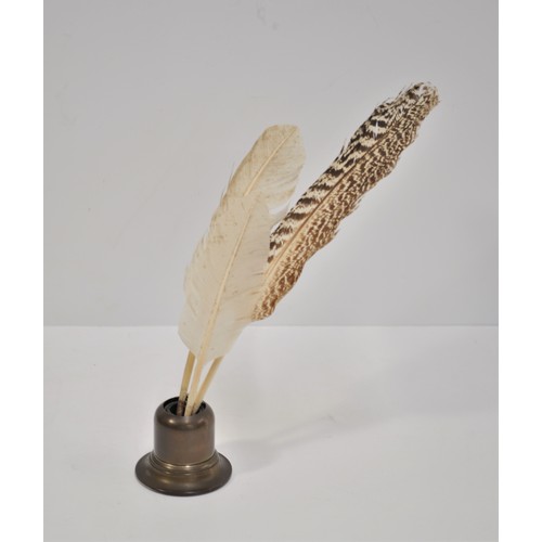 100 - Three Feather quills together with brass coloured inkwell with retractable cover