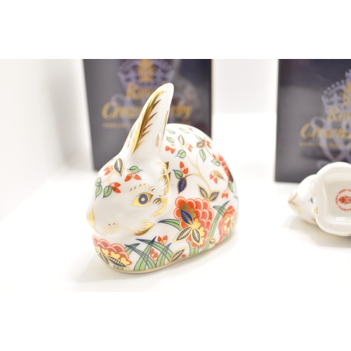 91 - Royal Crown Derby paperweight group consisting of baby rabbit, Meadow Rabbit and Rabbit, all with go... 