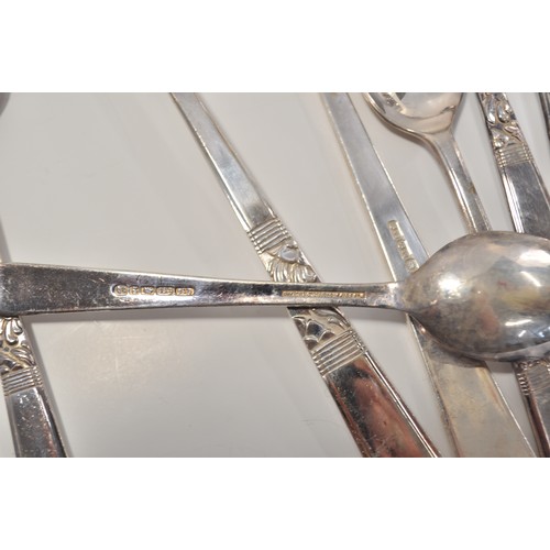 105A - Six person cutlery by Smith Seymour together with decorative napkin rings