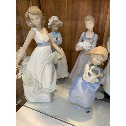 72 - Group of Llladro/Nao porcelain figures predominately themed children with animals, x9 items in total