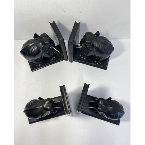 38A - Group of ebonised book ends in the form of elephants