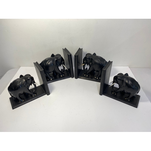 38A - Group of ebonised book ends in the form of elephants