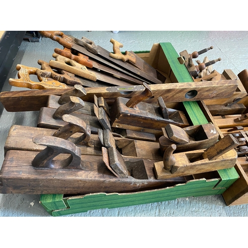 166 - A quantity of wood working tools to include saws, plough planes, rebate planes with blades, spirit l... 