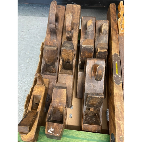 166 - A quantity of wood working tools to include saws, plough planes, rebate planes with blades, spirit l... 