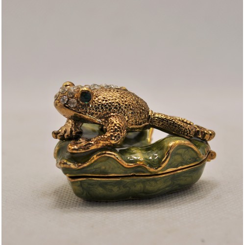 168 - A silver frog brooch together with a magnetic frog dish with diamontes and a frog pendant and chain