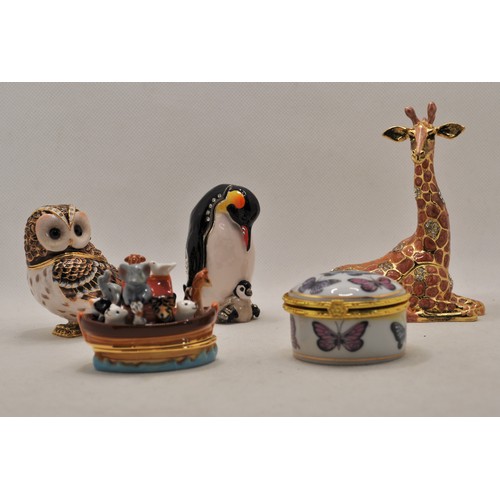 169 - A collection of three Hidden Treasures items to include the owl, penguins, and giraffe together with... 