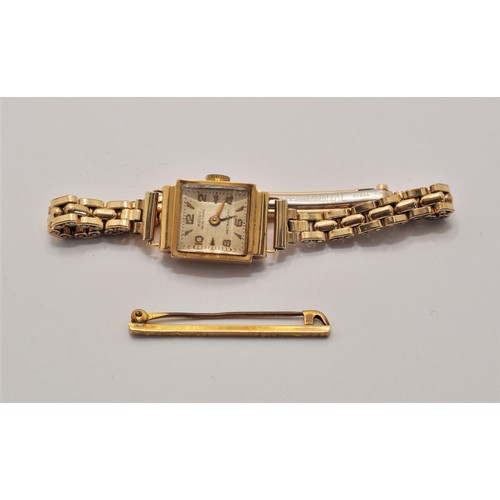 172 - Vintage Wolux wristwatch, case marked 18ct (strap rolled gold) together with 9ct gold bar brooch