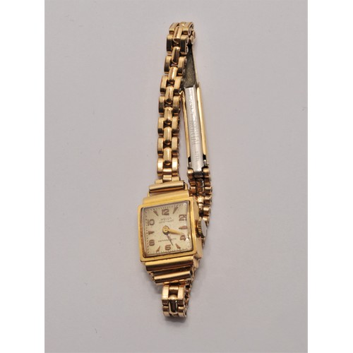 172 - Vintage Wolux wristwatch, case marked 18ct (strap rolled gold) together with 9ct gold bar brooch