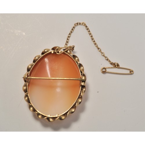 194 - 9ct gold cameo brooch with safety chain, approx length 4cm x 3.2cm wide. approx gross weight 10g