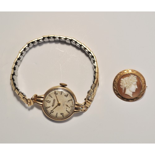 198 - Cameo pin badge and rotary wrist watch both in 9ct gold. approx combined gross weight 21.4g