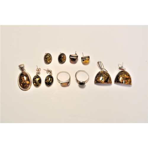 200 - Amber and silver jewellery items consisting of earrings, pendants and rings