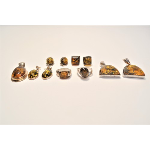 200 - Amber and silver jewellery items consisting of earrings, pendants and rings