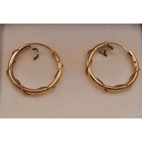 223 - Two pairs of gold hoop earrings, larger pair marked 375, approx. gross weight 3.6g