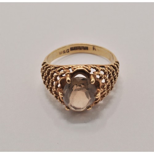 233 - 9ct yellow gold ring with smoky quartz central stone. Stamped 375, hallmarked Birmingham c. 1973. ap... 