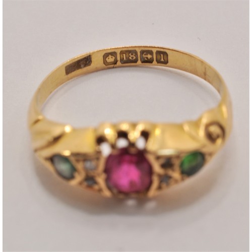 235 - 18ct yellow gold ring with central garnet with smaller clear and green stones to the surround. Appro... 