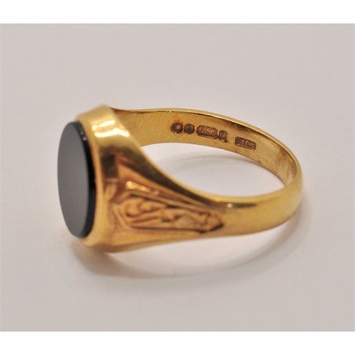 239 - 9ct yellow gold signet ring with black stone, approx. size K, approx. gross weight 2.5g marked 375