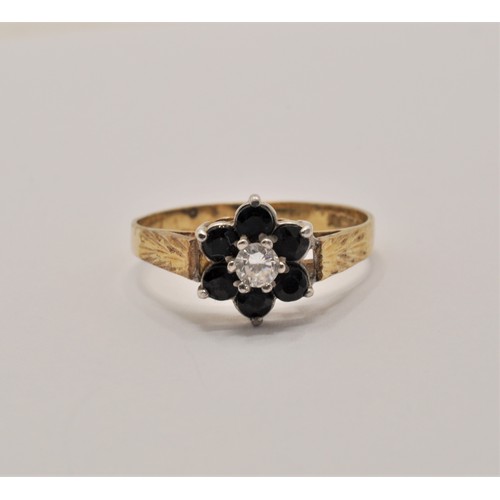 240 - 9ct yellow gold ring with a clear stone to the front in a flower design. marked 375, approx. gross w... 