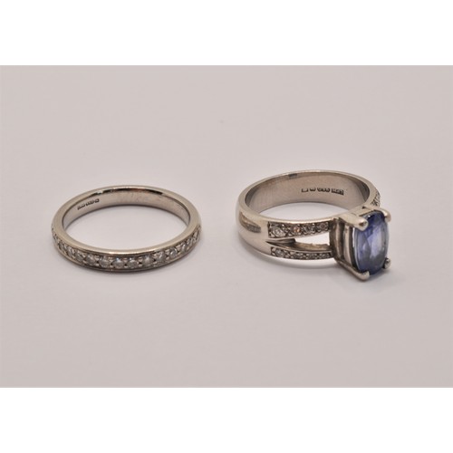 241 - X2 platinum rings, both hallmarked Birmingham stamped 950. One ring with a central sapphire approx. ... 