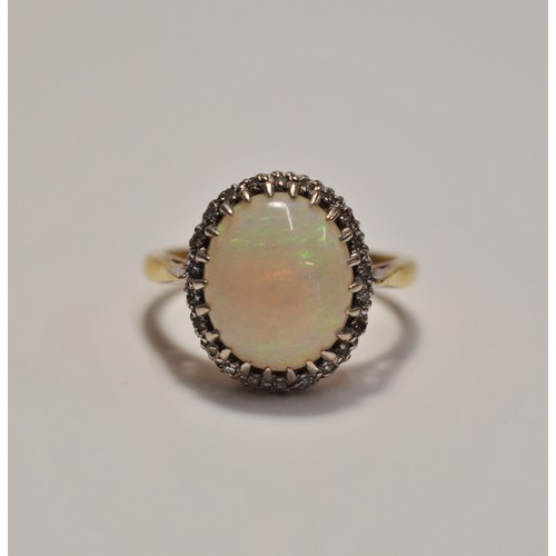 244 - 18ct yellow gold opal ring with diamonds to the surround, stamped 18ct, approx. size N, approx. gros... 