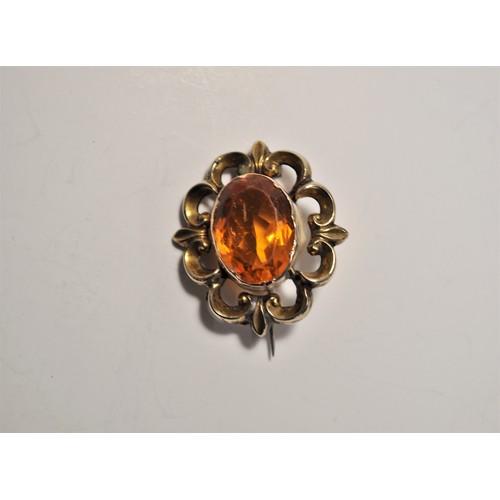 163 - Vintage jewellery consisting of; a brooch stamped 9ct foreign, gold brooch with central orange stone... 