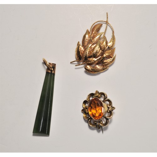 163 - Vintage jewellery consisting of; a brooch stamped 9ct foreign, gold brooch with central orange stone... 