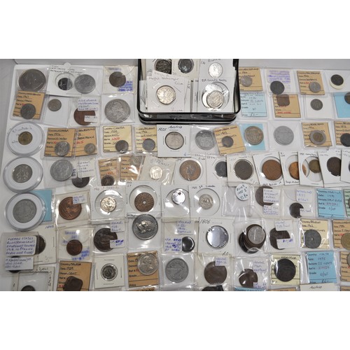 129 - A retired collector's collection of various worldwide coins and tokens from countries such as Britai... 