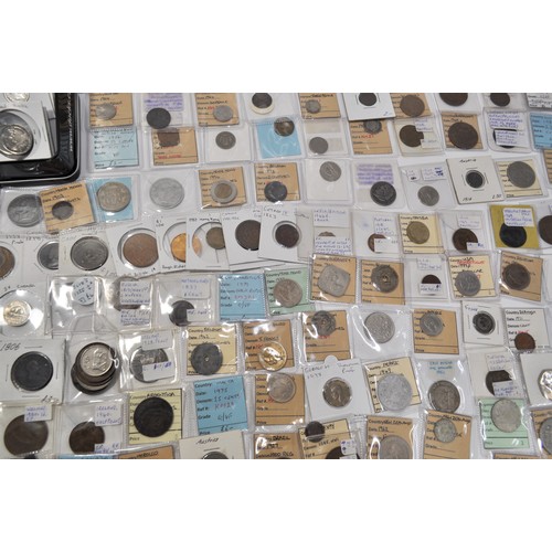 129 - A retired collector's collection of various worldwide coins and tokens from countries such as Britai... 