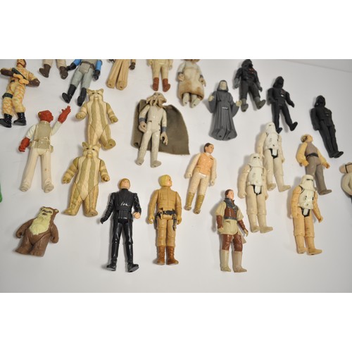 27 - A quantity of Star Wars figures and others, some dating from 1977 and other various 1980's figures, ... 