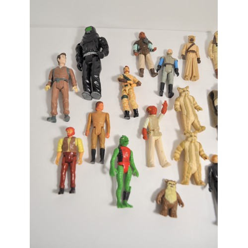 27 - A quantity of Star Wars figures and others, some dating from 1977 and other various 1980's figures, ... 