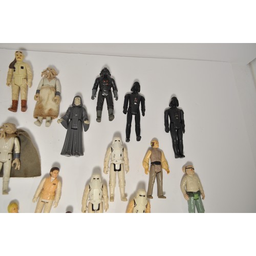 27 - A quantity of Star Wars figures and others, some dating from 1977 and other various 1980's figures, ... 