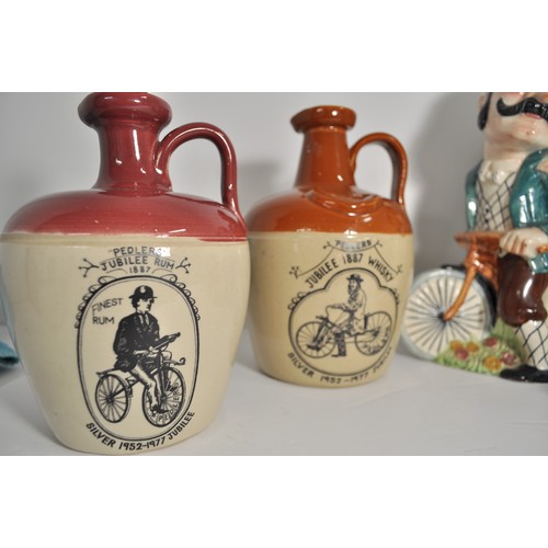 54 - Cycling interest - A collection of ceramics, comprising: Shorter Daisy Bell figures in two sizes the... 