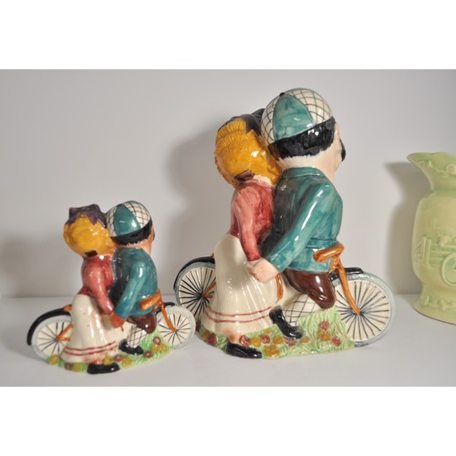 54 - Cycling interest - A collection of ceramics, comprising: Shorter Daisy Bell figures in two sizes the... 