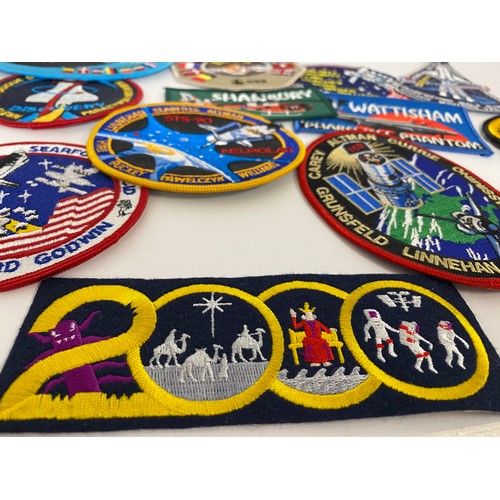 62 - A collection of 58 assorted cloth/embroidered NASA and space-related badges, including Apollo, Pegas... 