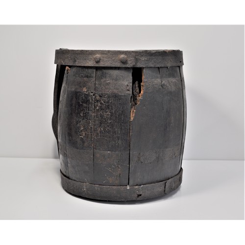 84 - An oak barrel painted black with 