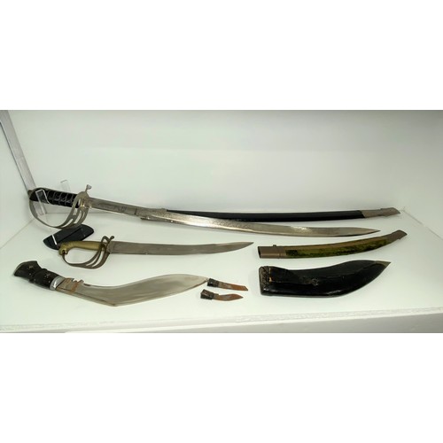 87 - x2 Indian  swords with decorative blades marked Made in India with scabbards, together with a Kukri.... 