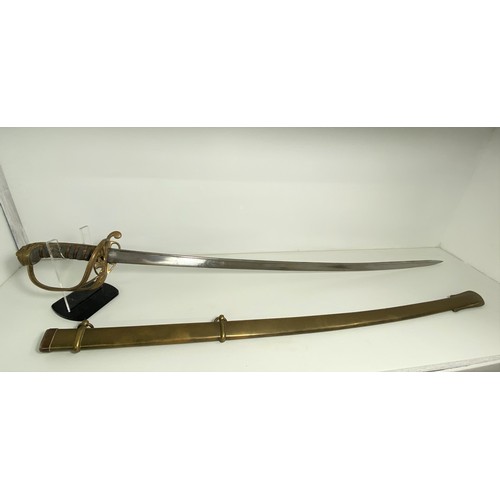 89 - Victorian reign British sword with brass hilt featuring VR cypher, slight curve to blade with  decor... 