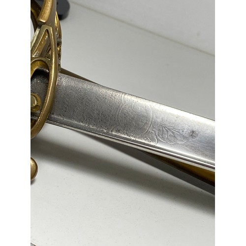 89 - Victorian reign British sword with brass hilt featuring VR cypher, slight curve to blade with  decor... 