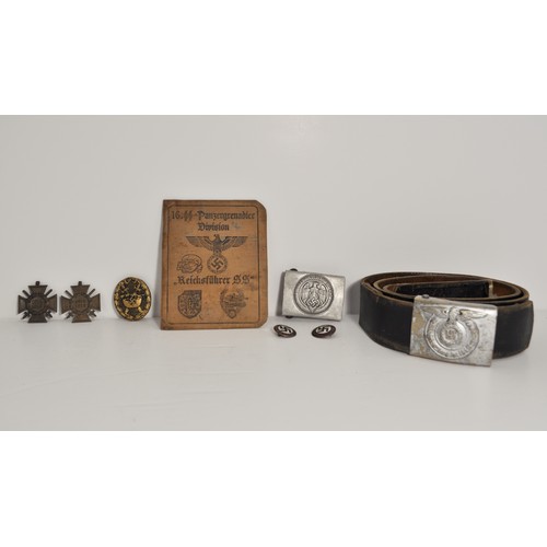 97 - German military interest consisting of various metal badges and medals together with belt and buckle... 